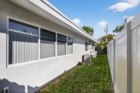 a view of a backyard with a tree