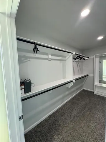 a view of a room with racks on the wall