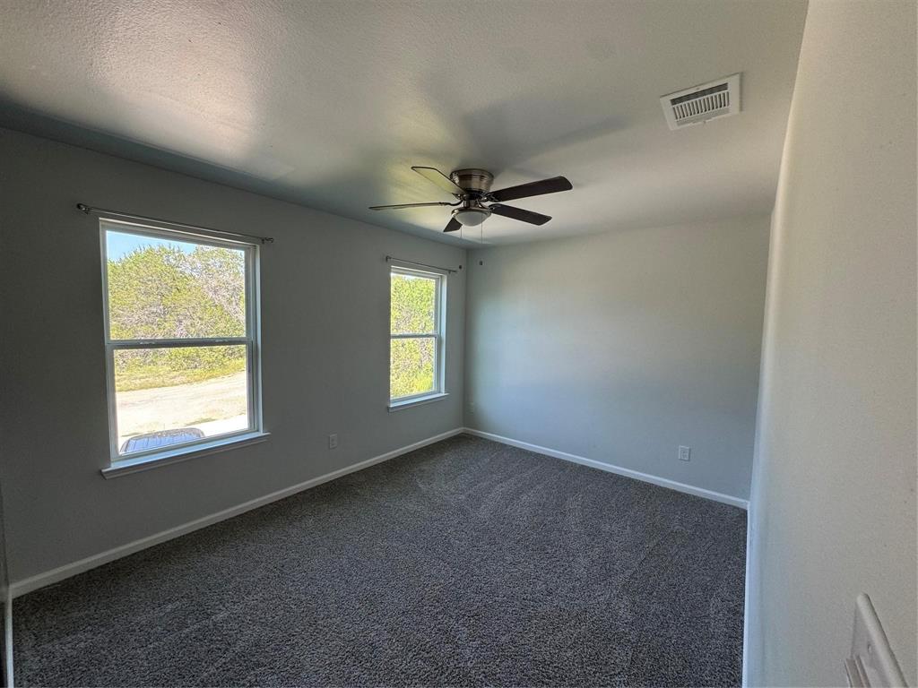 4720 Evening View Drive Granbury, TX 76048 - Photo 22 of 25 a view of an empty room with a window
