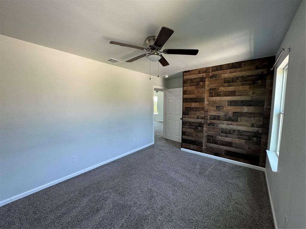 4720 Evening View Drive Granbury, TX 76048 - Photo 23 of 25 a view of room with a ceiling fan