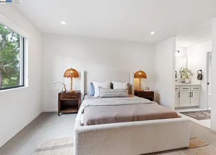 a bedroom with bed and window