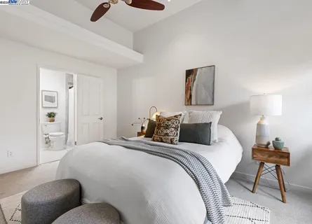 a bedroom with a bed and a chair