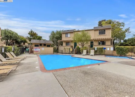 a view of swimming pool with outdoor seating