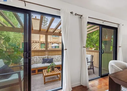 a view of an entryway with wooden floor and windows