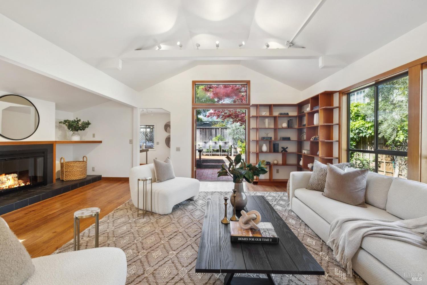 115 Pepper Avenue Larkspur, CA 94939 - Photo 1 of 1 a living room with furniture fireplace and a large window
