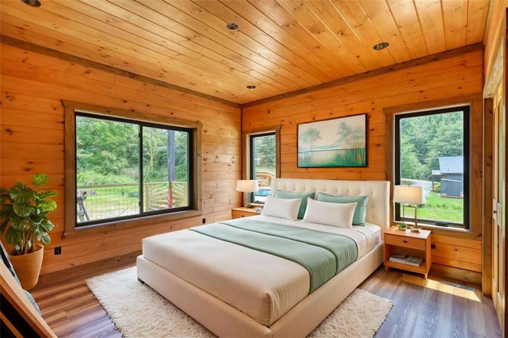 485 Church Street Blue Ridge, GA 30513 - Photo 20 of 85 a bedroom with a large bed and a large window