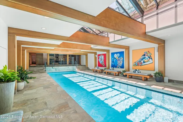 a view of swimming pool with a patio