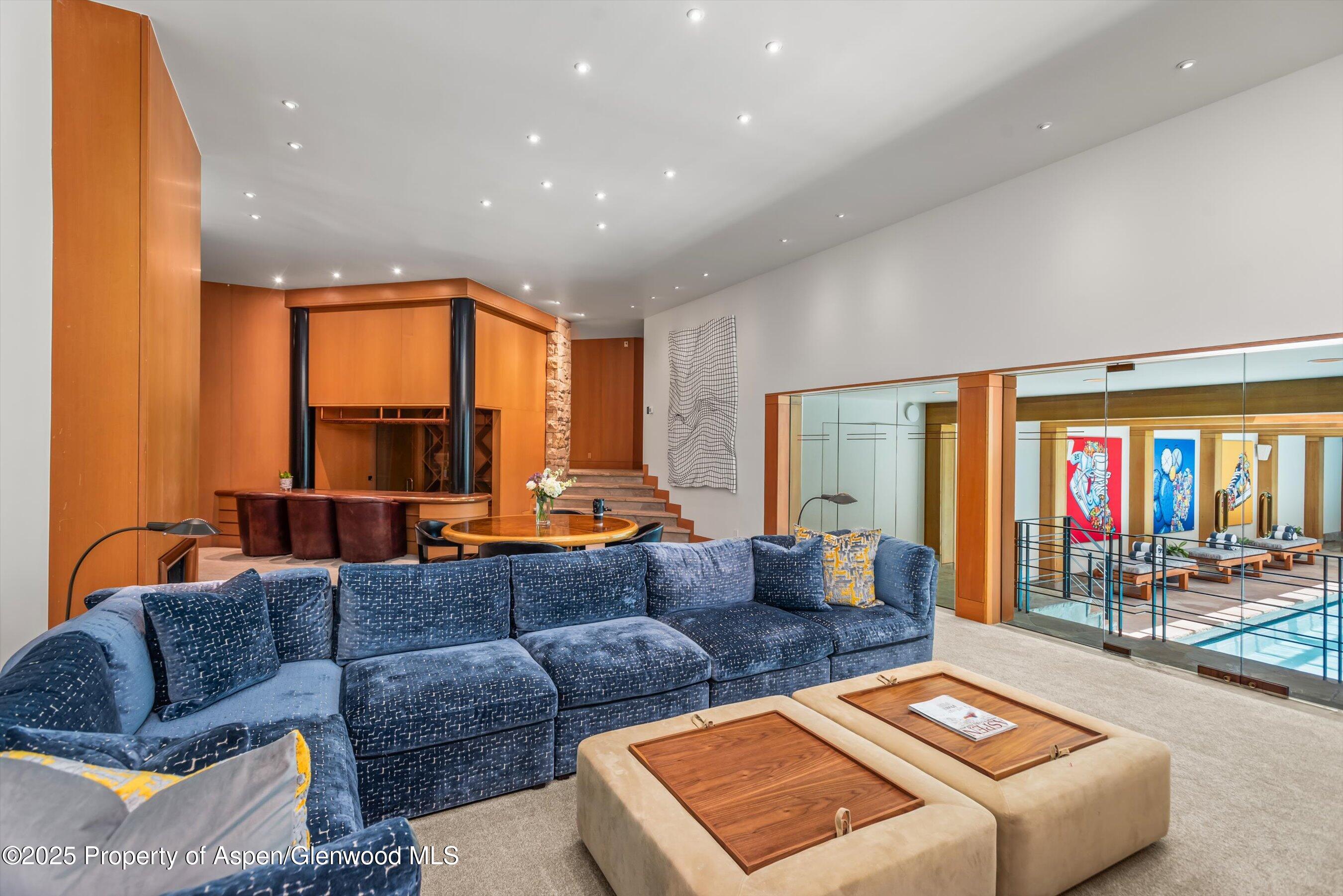 800 Roaring Fork Road Aspen, CO 81611 - Photo 21 of 37 a living room with furniture and a large window
