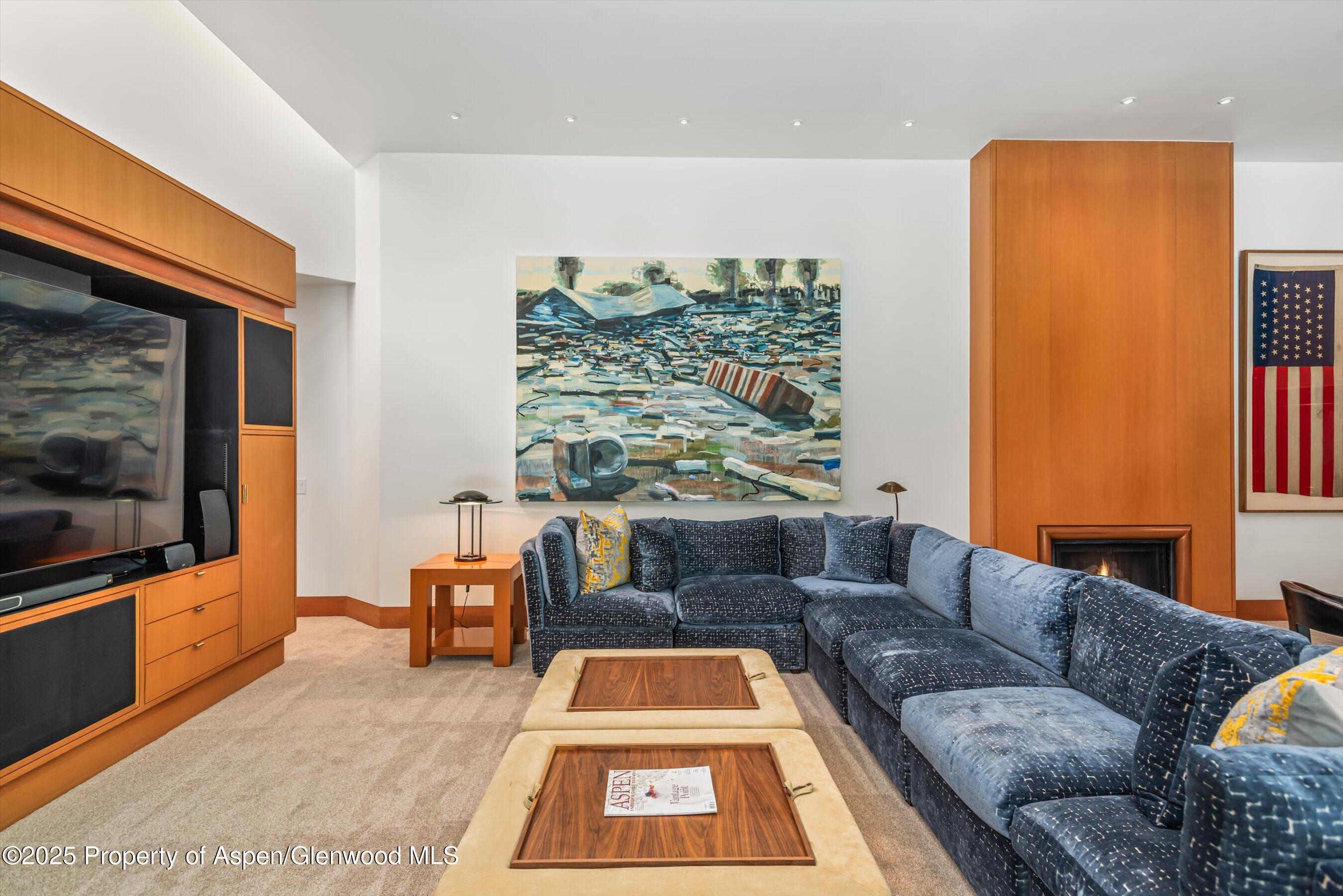 800 Roaring Fork Road Aspen, CO 81611 - Photo 23 of 37 a living room with furniture and a flat screen tv
