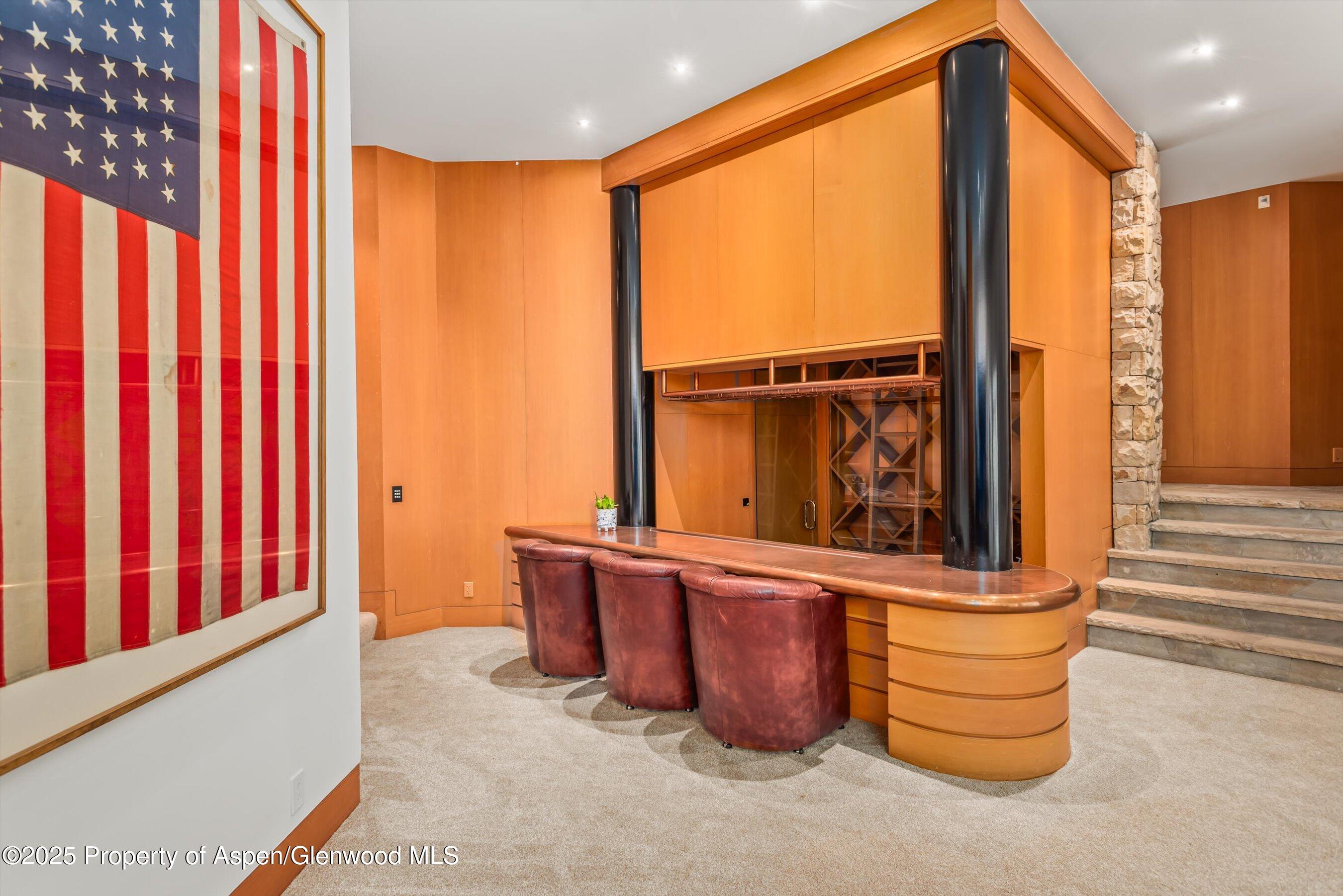 800 Roaring Fork Road Aspen, CO 81611 - Photo 24 of 37 a view of a balcony with furniture and door