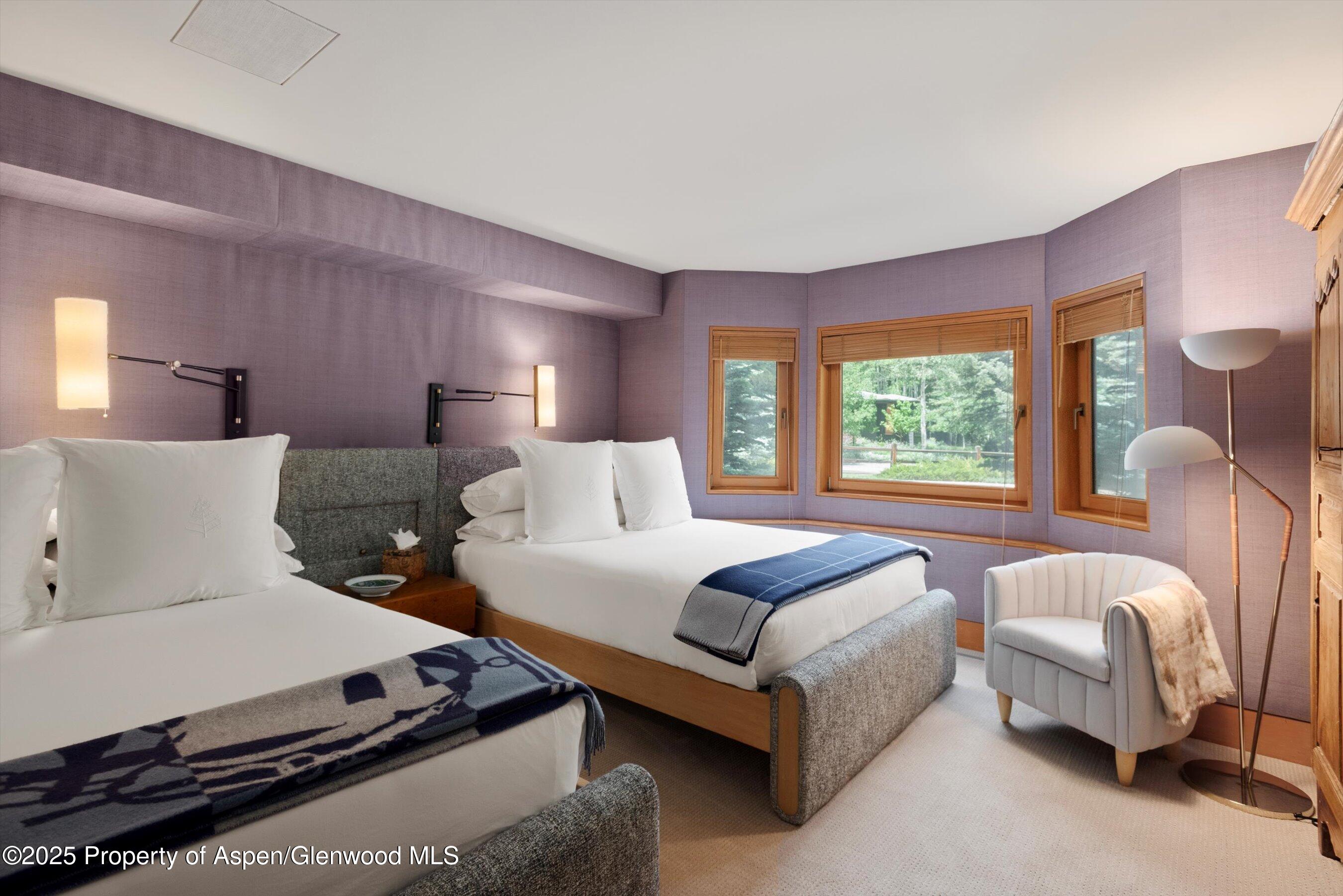 800 Roaring Fork Road Aspen, CO 81611 - Photo 34 of 37 a bedroom with a bed and window