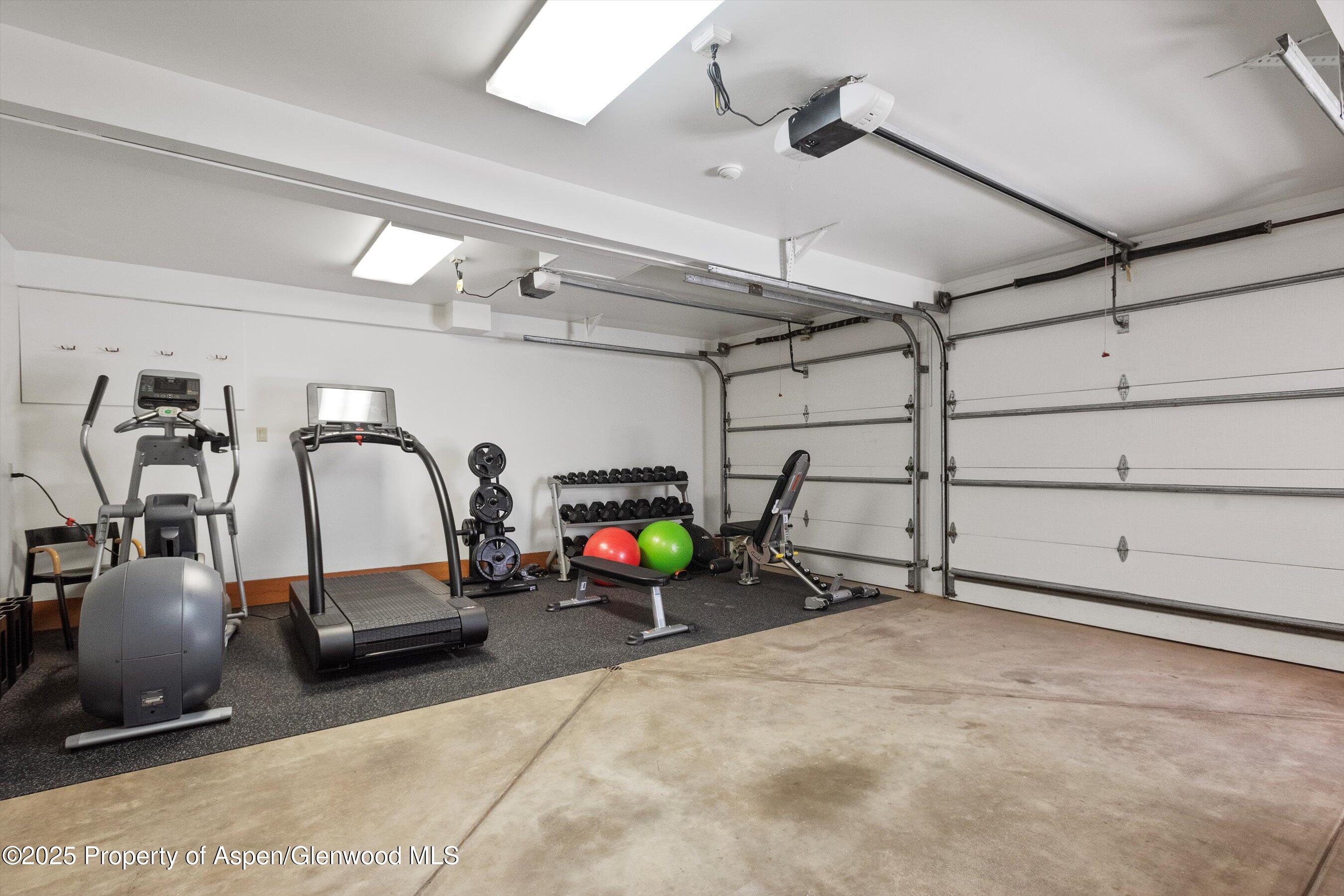 800 Roaring Fork Road Aspen, CO 81611 - Photo 36 of 37 a view of a garage with cars