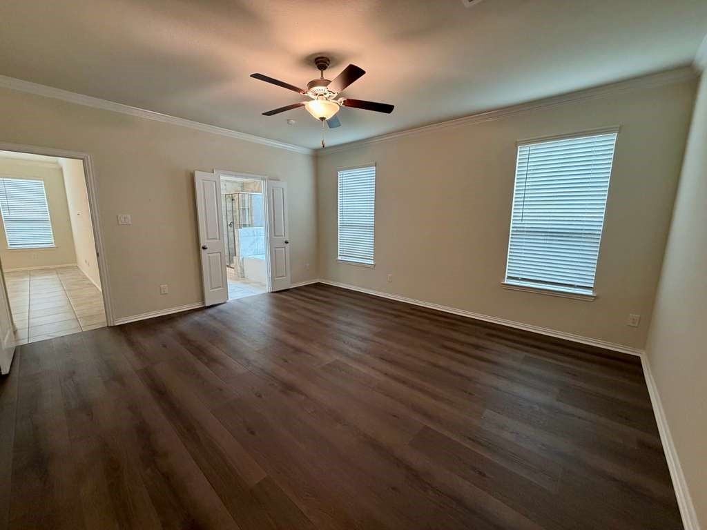 28614 Oakmist Point Lane Katy, TX 77494 - Photo 13 of 42 a view of an empty room with wooden floor and a window