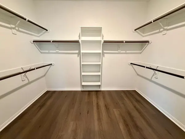 a view of an empty walk in closet