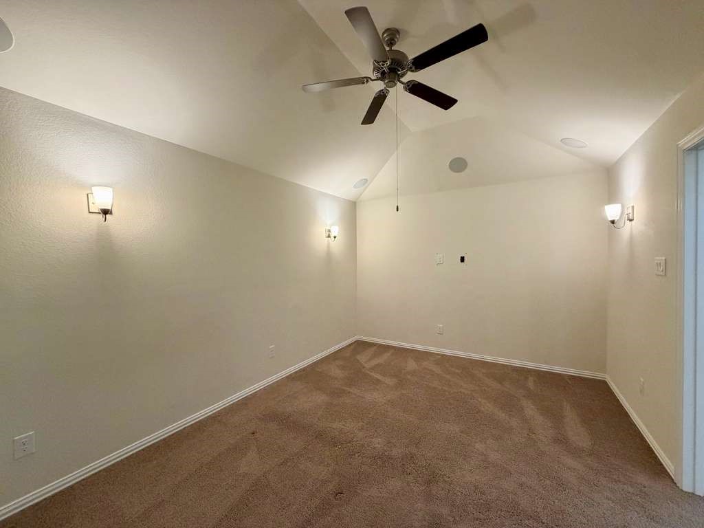 28614 Oakmist Point Lane Katy, TX 77494 - Photo 26 of 42 an empty room with a ceiling fan and window