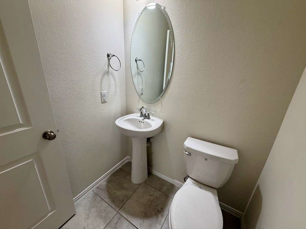 28614 Oakmist Point Lane Katy, TX 77494 - Photo 28 of 42 a bathroom with a toilet sink and mirror