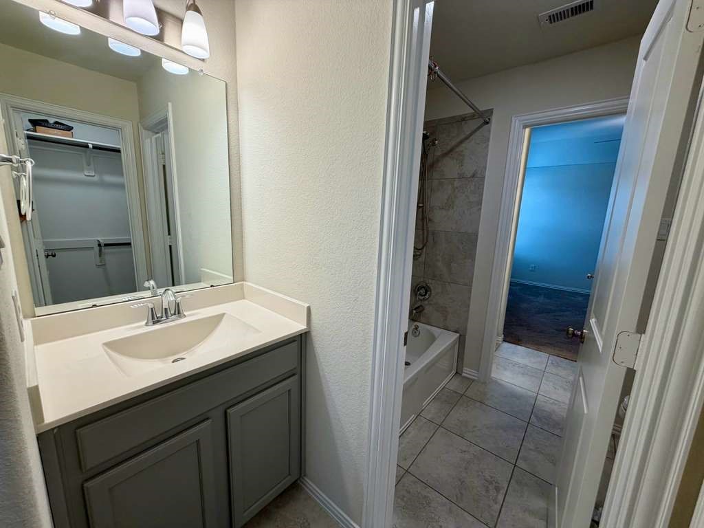 28614 Oakmist Point Lane Katy, TX 77494 - Photo 32 of 42 a bathroom with a sink and a mirror