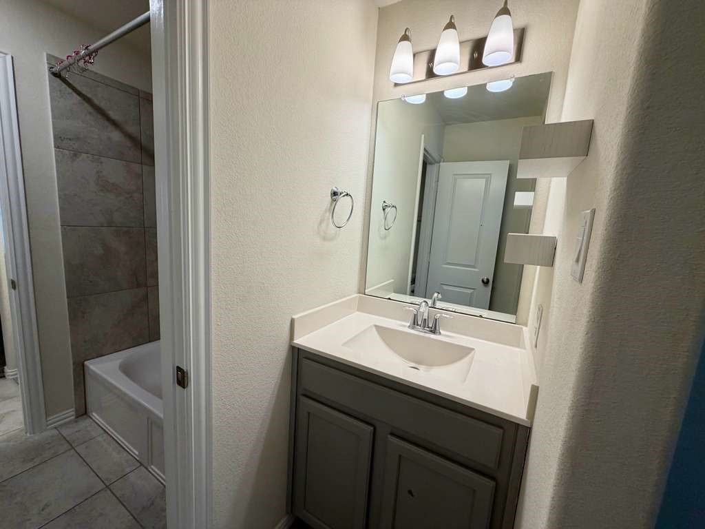 28614 Oakmist Point Lane Katy, TX 77494 - Photo 33 of 42 a bathroom with a sink and a mirror