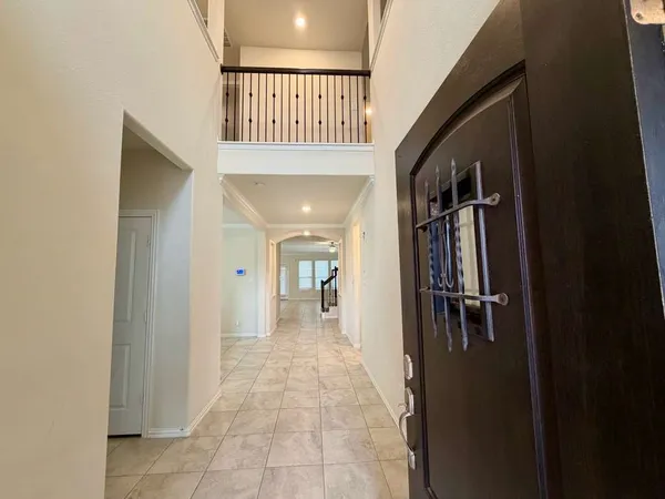 a kitchen with stainless steel appliances a stove a sink a microwave a counter top space cabinets and a window