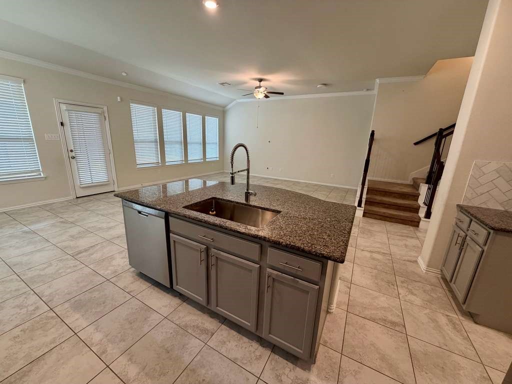 28614 Oakmist Point Lane Katy, TX 77494 - Photo 8 of 42 a kitchen with a sink a counter space and cabinets
