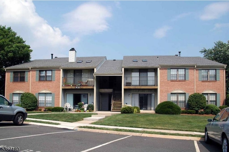 292 English Place Bernards, NJ 07920 - Photo 1 of 10 a front view of a house with a yard and garage