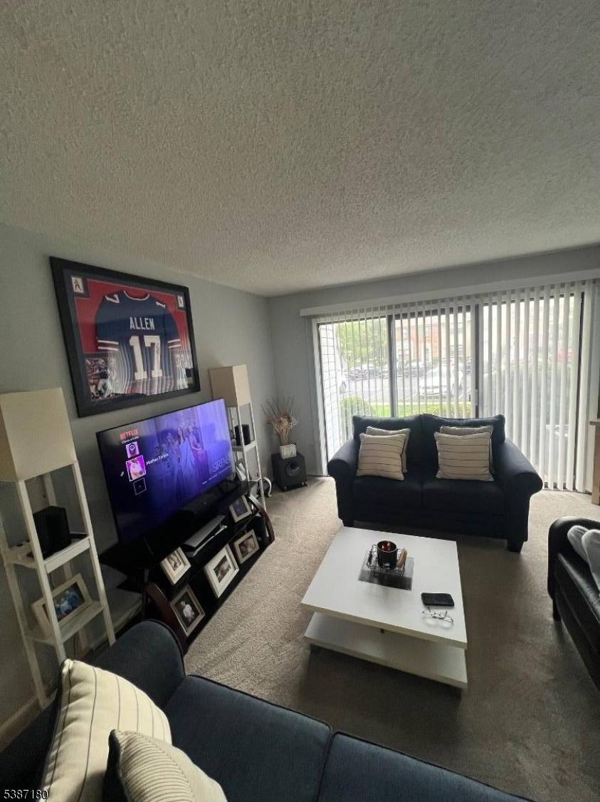 292 English Place Bernards, NJ 07920 - Photo 3 of 10 a living room with furniture a rug and a large window