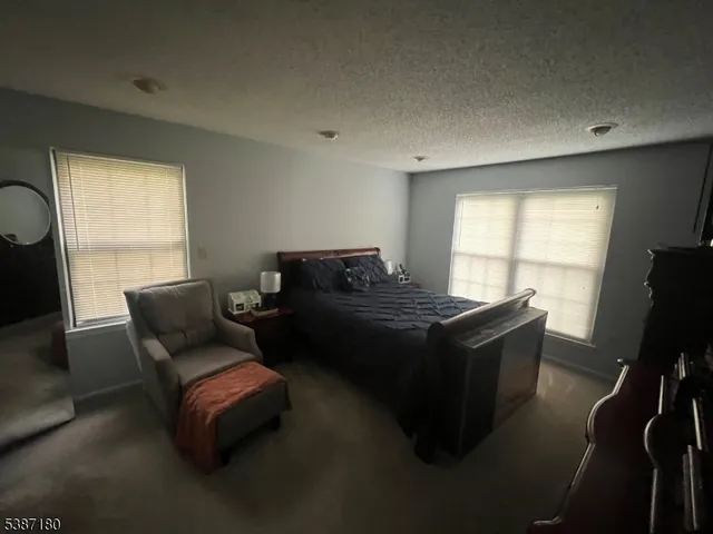 a living room with furniture wooden floor and a window
