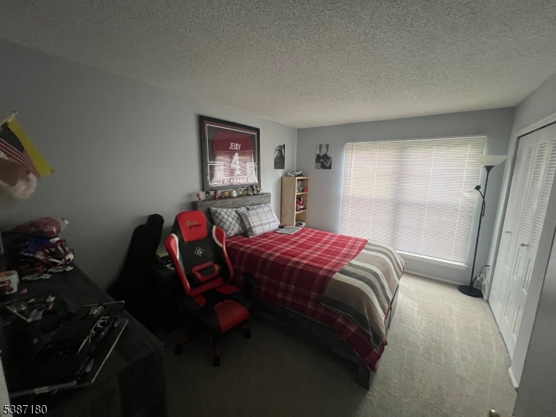 292 English Place Bernards, NJ 07920 - Photo 8 of 10 a bedroom with a bed and a window