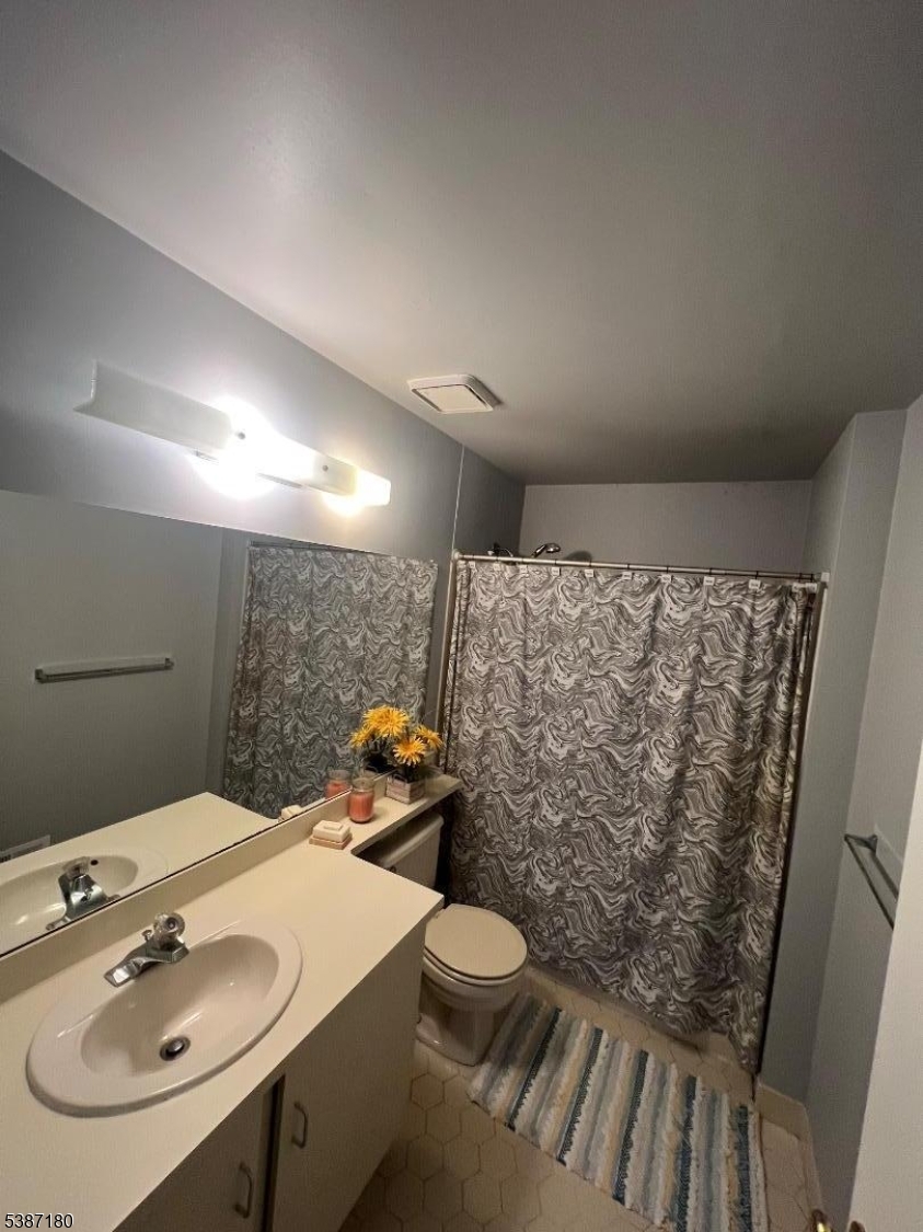 292 English Place Bernards, NJ 07920 - Photo 9 of 10 a bathroom with a sink toilet and shower