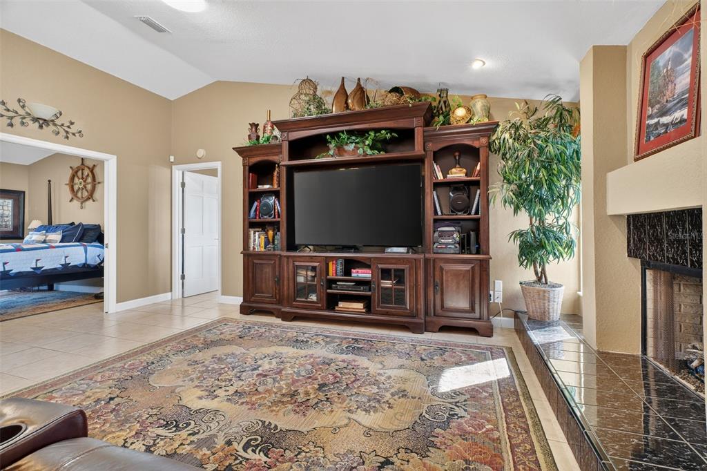 115 Hunting Lodge Drive Inverness, FL 34453 - Photo 13 of 59 a living room with furniture and a flat screen tv
