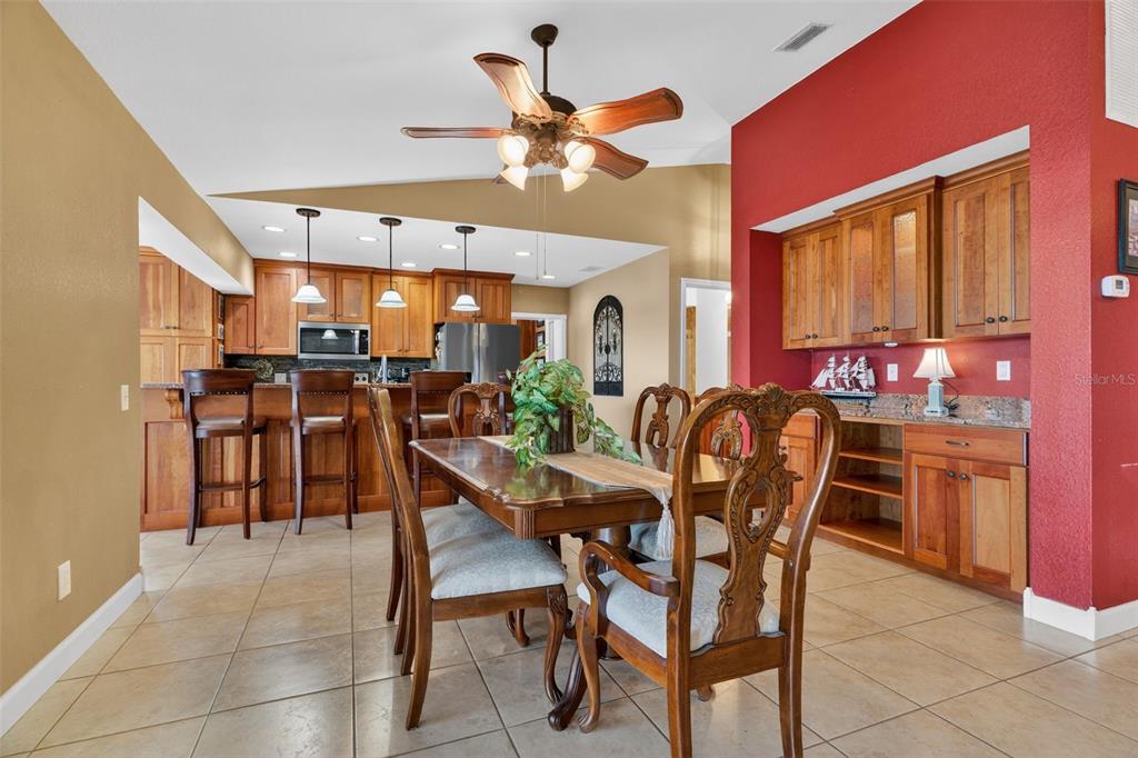 115 Hunting Lodge Drive Inverness, FL 34453 - Photo 16 of 59 a view of a dining room with furniture and chandelier