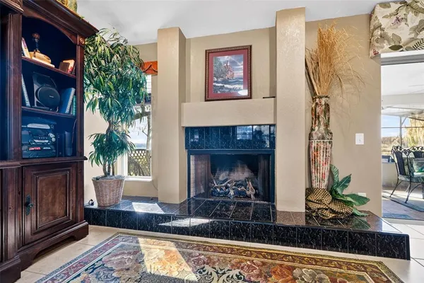 a kitchen with granite countertop a sink a stove and a wooden cabinets