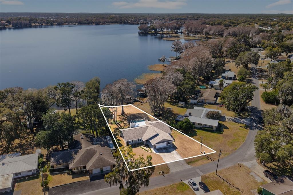 115 Hunting Lodge Drive Inverness, FL 34453 - Photo 2 of 59 an aerial view of a house with lake view