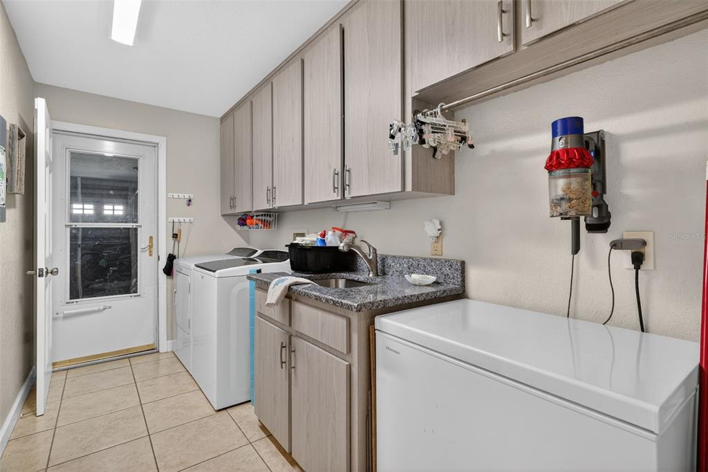 115 Hunting Lodge Drive Inverness, FL 34453 - Photo 29 of 59 a utility room with dryer and washer