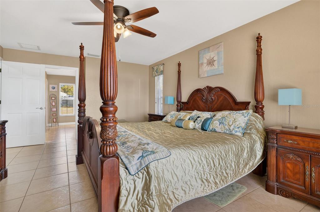 115 Hunting Lodge Drive Inverness, FL 34453 - Photo 31 of 59 a bedroom with a bed and a mirror