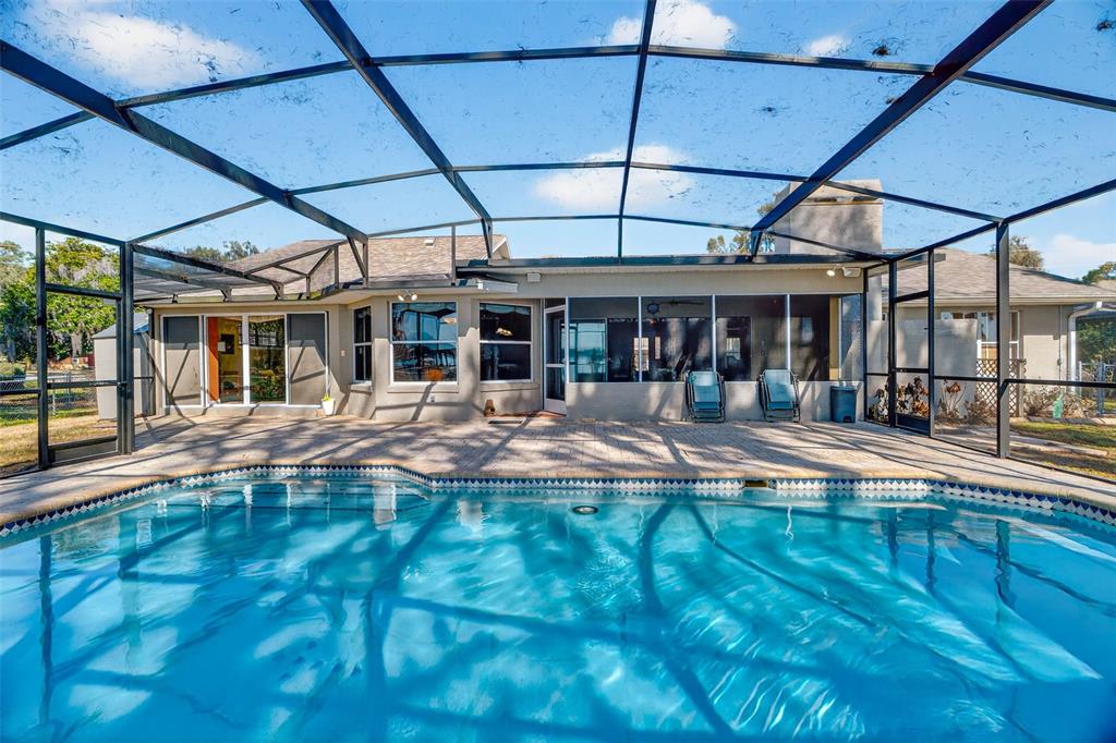 115 Hunting Lodge Drive Inverness, FL 34453 - Photo 39 of 59 a view of a swimming pool with a patio