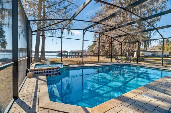 a view of swimming pool with outdoor space and seating area