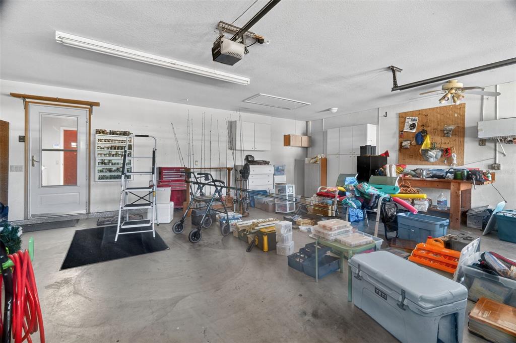 115 Hunting Lodge Drive Inverness, FL 34453 - Photo 57 of 59 a living room with lots of furniture and gym equipment