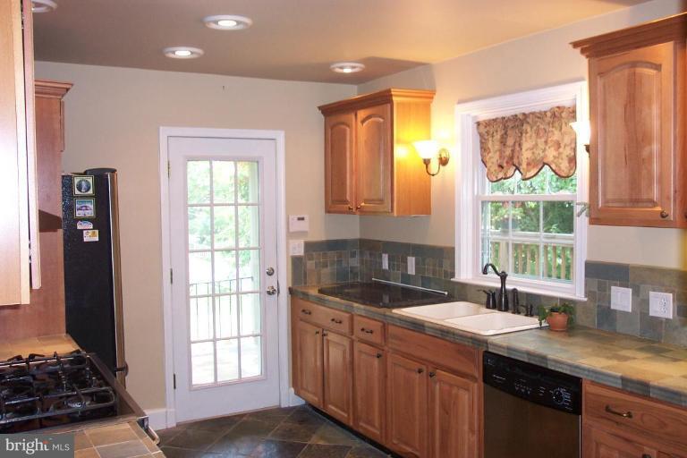 7114 York Road Baltimore, MD 21212 - Photo 13 of 15 a kitchen with granite countertop a sink and a window