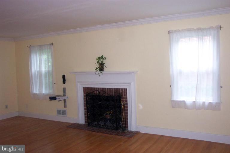 7114 York Road Baltimore, MD 21212 - Photo 9 of 15 an empty room with windows and fireplace