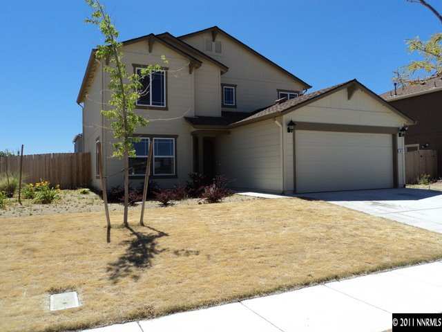 8910 Yeager Street Reno, NV 89506 - Photo 1 of 13 a view of a house with snow on the road