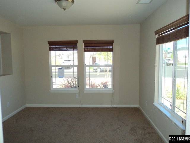 8910 Yeager Street Reno, NV 89506 - Photo 3 of 13 an empty room with a window