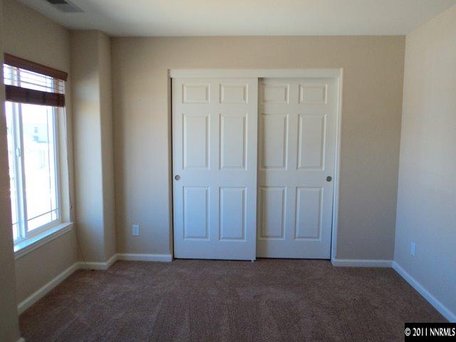 8910 Yeager Street Reno, NV 89506 - Photo 7 of 13 an empty room with windows