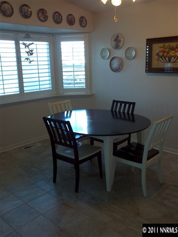 60 Ghost Rider Drive Reno, NV 89511 - Photo 4 of 13 a view of a dining room with furniture and a window