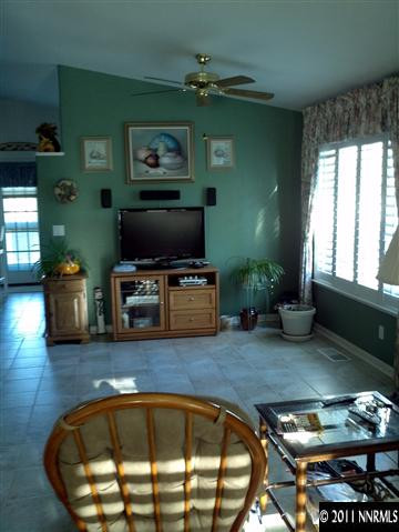 60 Ghost Rider Drive Reno, NV 89511 - Photo 5 of 13 a view of a livingroom with furniture and a flat screen tv