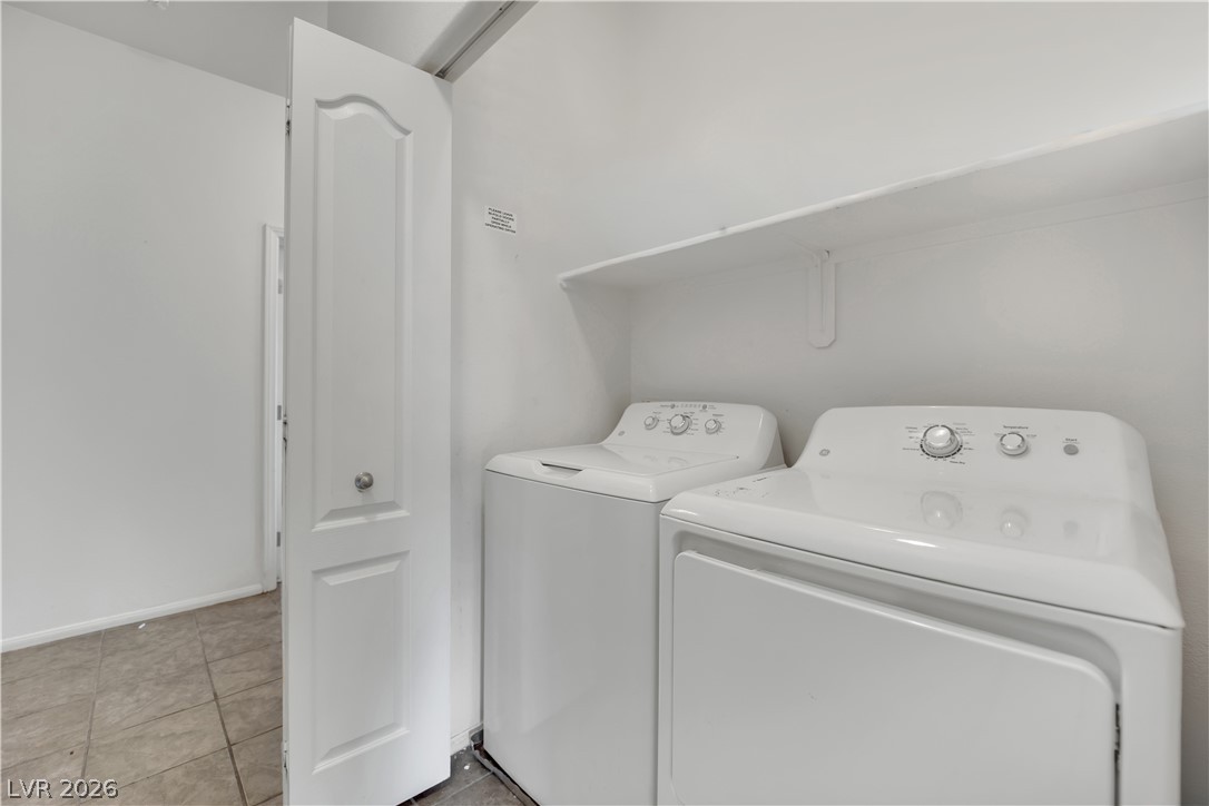 2305 West Horizon Ridge Parkway, Unit 2722 Henderson, NV 89052 - Photo 11 of 23 Laundry area with washer and clothes dryer and baseboards