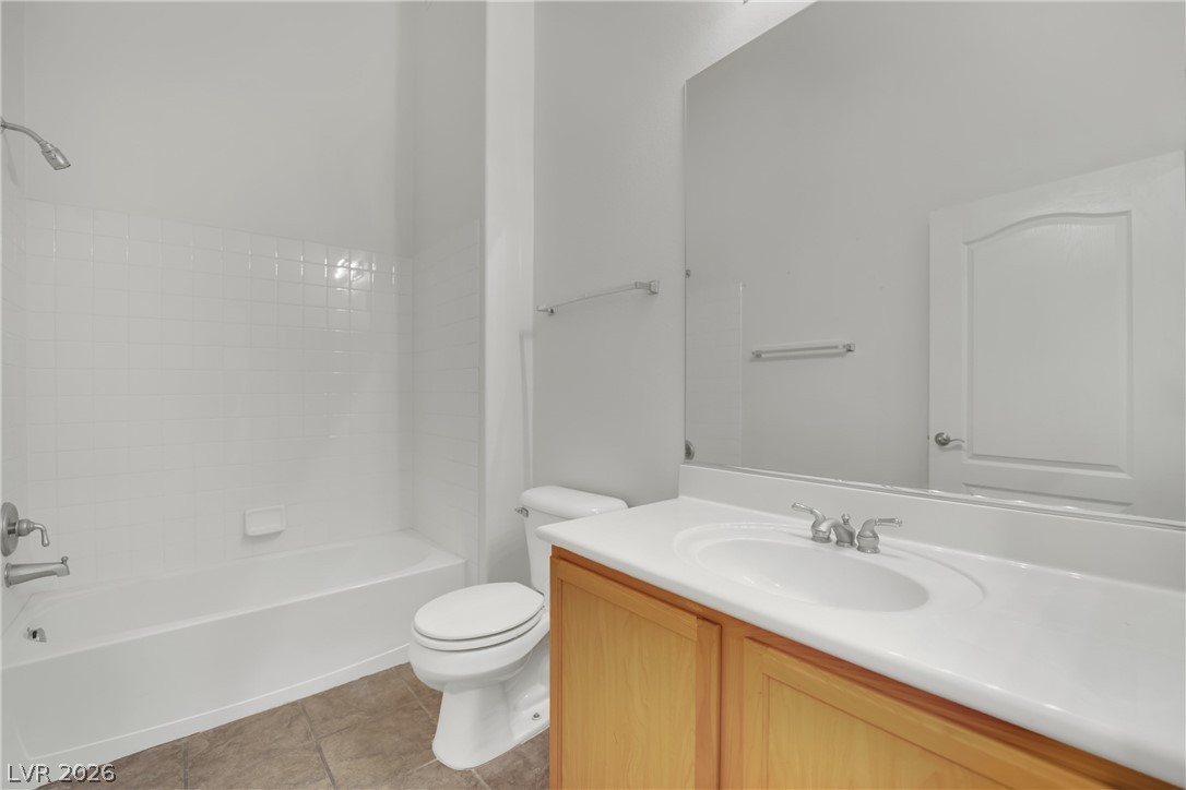 2305 West Horizon Ridge Parkway, Unit 2722 Henderson, NV 89052 - Photo 10 of 23 Bathroom with vanity, bathing tub / shower combination, and light tile patterned floors