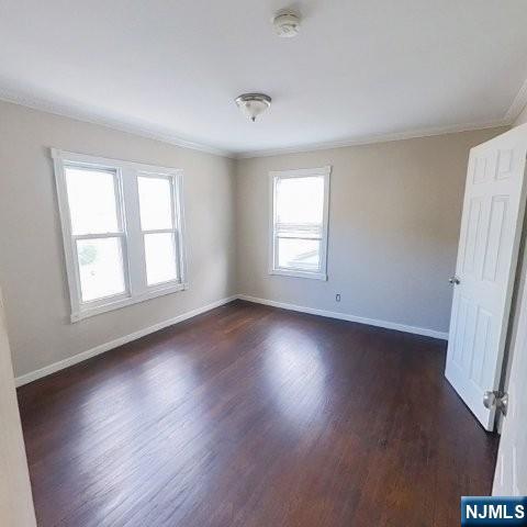 167 James Street Hackensack, NJ 07601 - Photo 18 of 30 an empty room with wooden floor and windows
