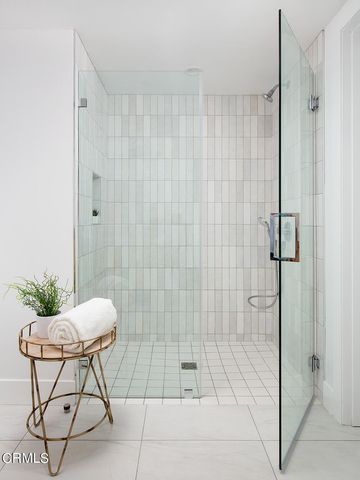 a bathroom with a shower and a sink