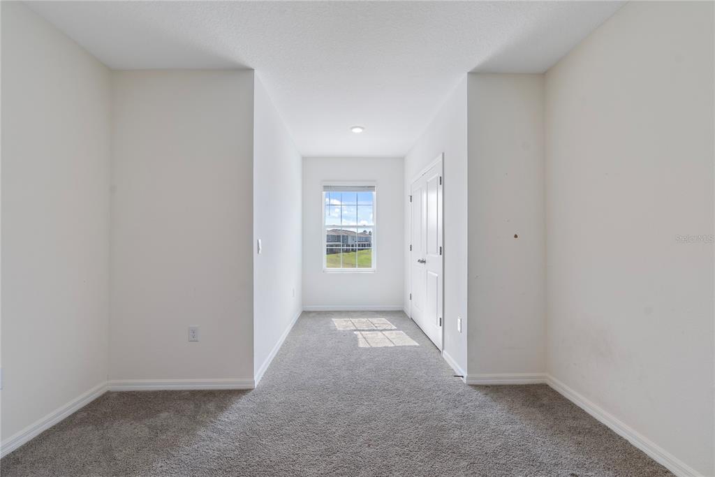 32395 Turtle Grace Loop Wesley Chapel, FL 33545 - Photo 15 of 39 an empty room with windows